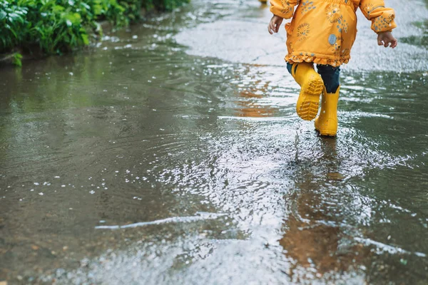 Girl Yellow Jacket Rubber Boots Runs Puddles — Foto Stock