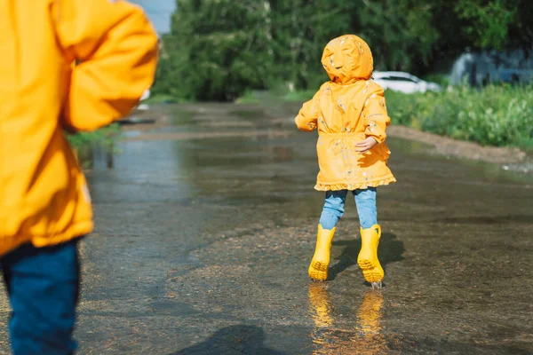 Children Yellow Rubber Boots Walk Puddles — Foto Stock