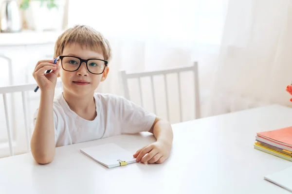 Boy Eyeglasses Writes Letters Notebook Pen — Stock Photo, Image