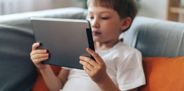 Boy Sitting Couch Watching Video Tablet — Foto de Stock