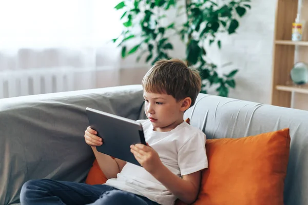 Boy Sitting Couch Watching Video Tablet — Foto de Stock