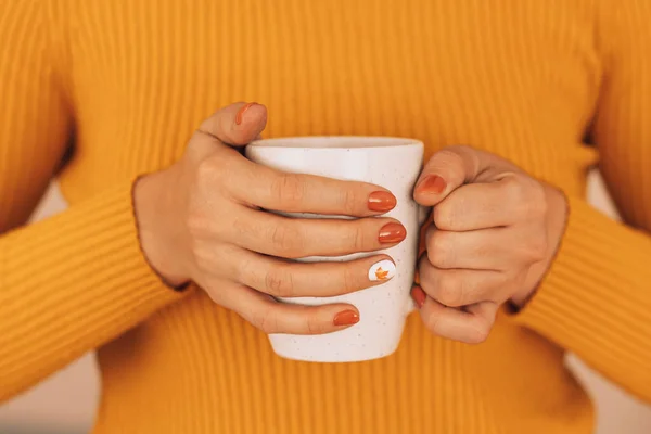 Girl Orange Sweater Holding White Mug Hot Drink Her Hands — 스톡 사진