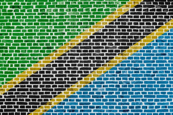 Närbild Tegelvägg Med Tanzanias Flagga Målad Den — Stockfoto