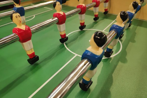 Table football, commonly called fuzboll or foosball and sometimes table soccer, is a table-top game that is loosely based on association football.