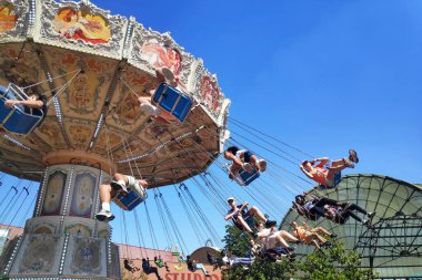 Plailly, France - August 10 2022: Les Chaises volantes is a swing ride located in Parc Asterix, a theme park in France based on the comic book series Asterix by Albert Uderzo and Rene Goscinny.