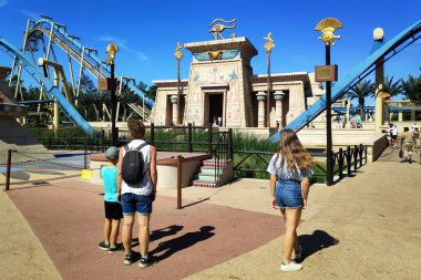Plailly, France - August 10 2022: OzIris is a steel inverted roller coaster located in Parc Asterix, a theme park in France based on the comic book series Asterix by Albert Uderzo and Rene Goscinny.