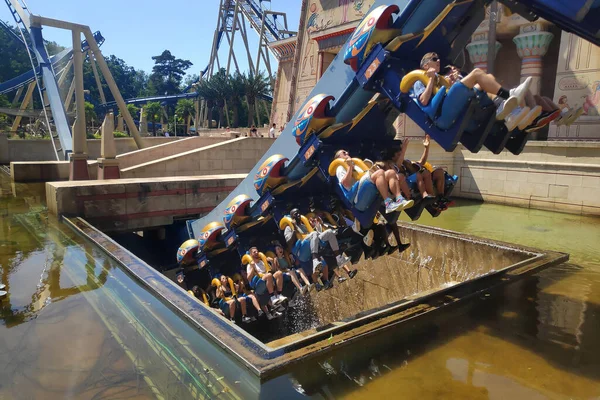 Plailly, France - August 10 2022: OzIris is a steel inverted roller coaster located in Parc Asterix, a theme park in France based on the comic book series Asterix by Albert Uderzo and Rene Goscinny.