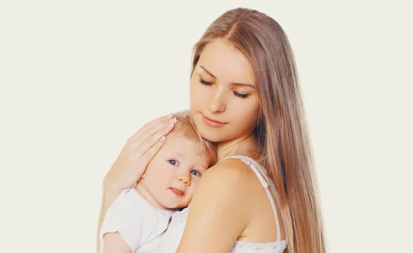 Portrait Beautiful Young Mother Hugging Soothes Her Baby White Background — Stock Photo, Image