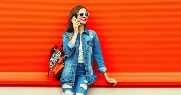 Portrait Smiling Young Woman Calling Smartphone Wearing Denim Jacket Red Royalty Free Stock Photos