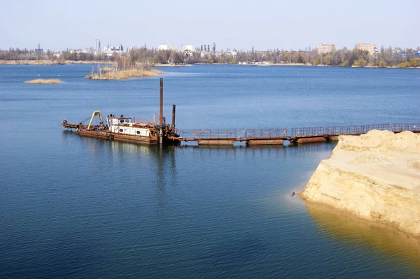Large industrial pump for pumping sand from the bottom of the lake. Work on the extraction of sand in Ukraine.