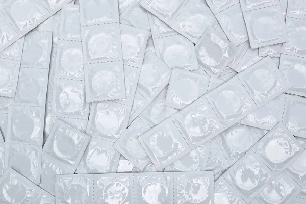 Many White Packages Unopened Condoms Background Using Condom Reduce Chance — Foto de Stock