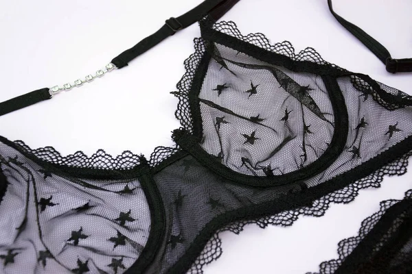 Lace sexy black womens underwear, on light background. Black lace lingerie. Fashion Concept. Women's bra, panties, erotic clothes. Lingerie advertising