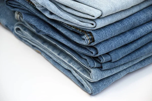 Sacco Pantaloni Jeans Una Pila Sfondo Denim Concetto Acquisto Vendita — Foto Stock