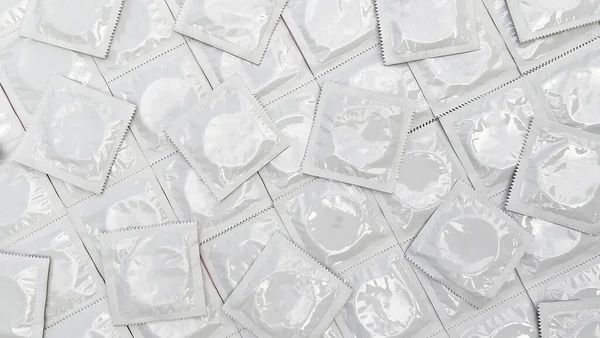 Many White Packages Unopened Condoms Background Using Condom Reduce Chance —  Fotos de Stock