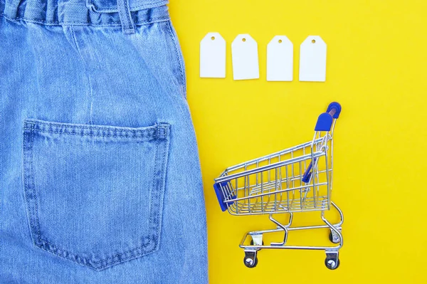 Flat Lay Detail Blue Jeans Shopping Cart Blank White Labels — 스톡 사진