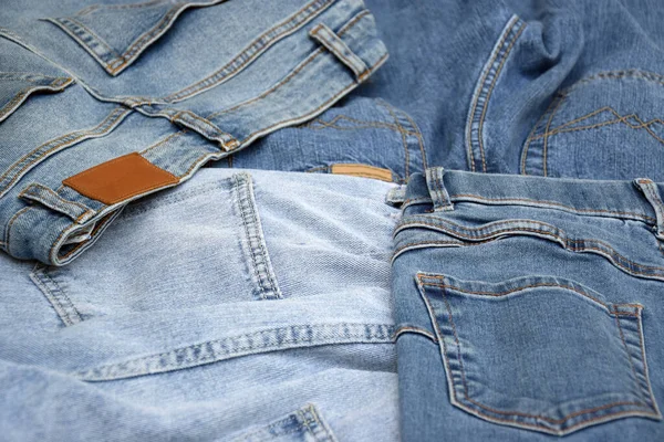 Sacco Pantaloni Jeans Una Pila Sfondo Denim Concetto Acquisto Vendita — Foto Stock