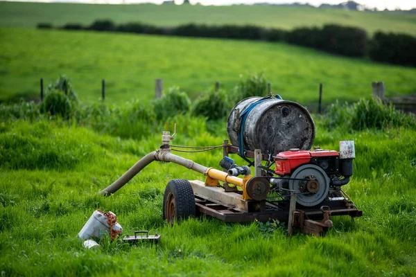 water pump, pumping water on a farm in summer. irrigation on a ranch in australia