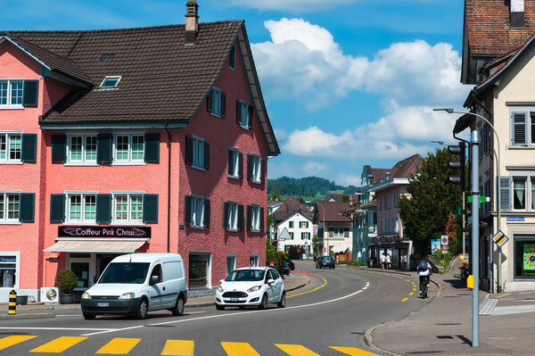 Wetzikon, Switzerland - May 14, 2022: Urban life and traffic on the street through Wetzikon at daytime