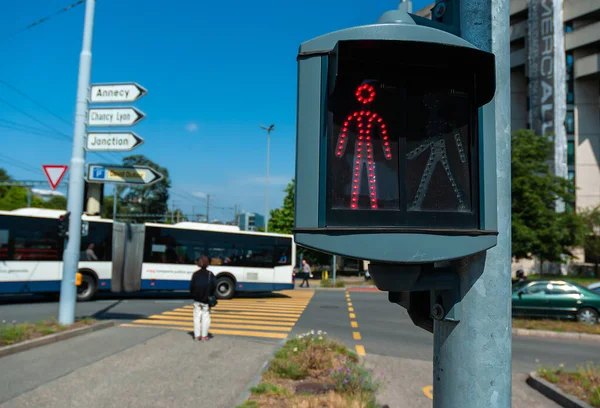 Red traffic light at a pedestrian crossing in Geneva, Switzerland