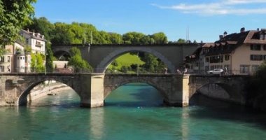 Bern, Switzerland - July 12, 2022: Historical old town of Bern with two bridges over the Aare river in summer