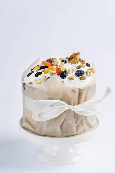 Easter cake with nuts and dry fruits. White background.