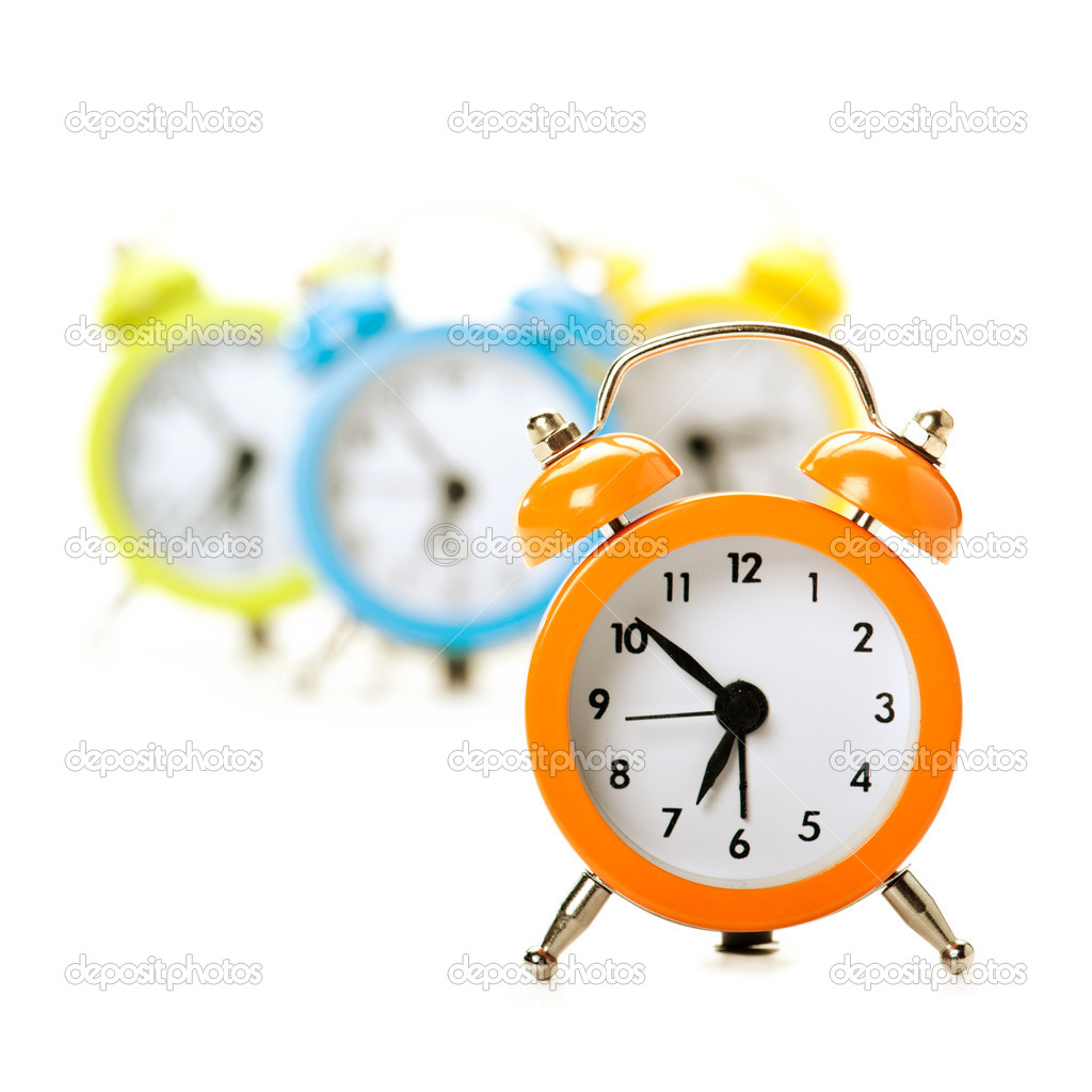 Four colorful alarm clocks