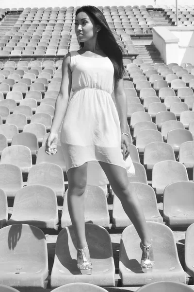 Asian Model Posing at the stadium standing on the bright seats — Stock Photo, Image