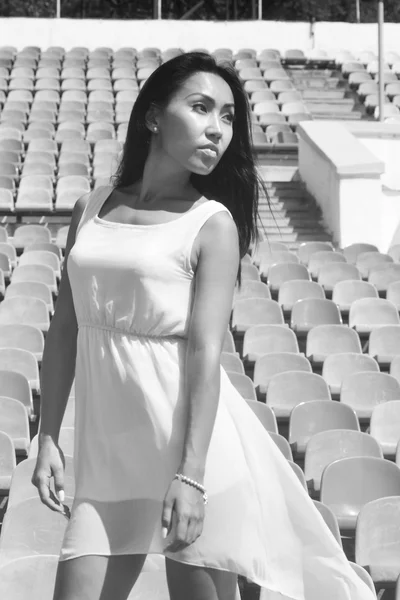 Asian Model Posing at the stadium standing on the bright seats — Stock Photo, Image