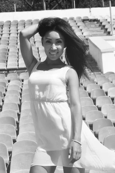 Asian Model Posing at the stadium standing on the bright seats — Stock Photo, Image