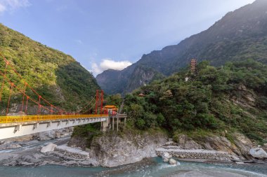 Beautiful scenic of the pagoda in the mountain with the long bridge across the river. (Tianfeng, Tianxiang,Taroko, Hualien, Taiwan.