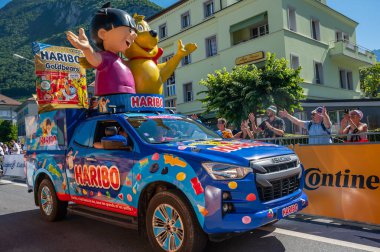 Aigle, Valais Canton, Switzerland -10.07.2022: Passage of an advertising car of Haribo in the caravan of the famous Tour de France in Switzerland.