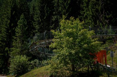 Summer toboggan in Switzerland. Run Strobl made of stainless steel. Amusement Park and attraction.