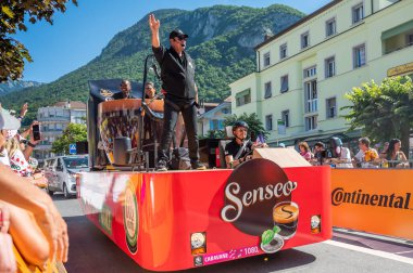 Aigle, Valais Canton, Switzerland -10 July, 2022: Passage of an advertising car of Senseo coffee brewing trademark in the caravan of the Tour de France in Switzerland.