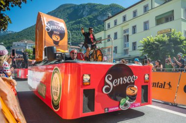 Aigle, Valais Canton, Switzerland -10 July, 2022: Passage of an advertising car of Senseo coffee brewing trademark in the caravan of the Tour de France in Switzerland.