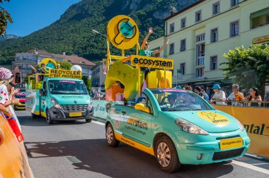 Aigle, Valais Canton, Switzerland -10 July, 2022: Passage of an advertising car of ecosystem in the caravan of the Tour de France in Switzerland. Promotion activity.