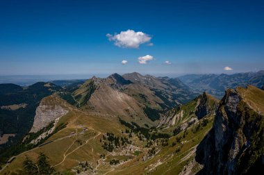 Panorama of the mountains in summer. Mountains, sky and clouds. Landscape of Rochers de Naye, Montreux, Switzerland. Travel destinations. clipart