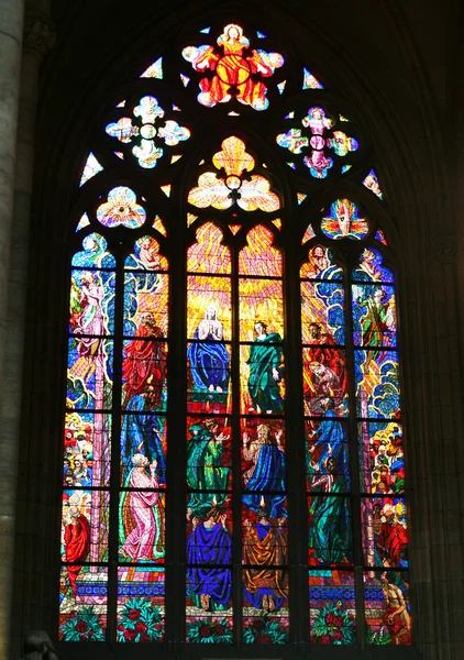 Stained Glass Window with Religious Symbols and People