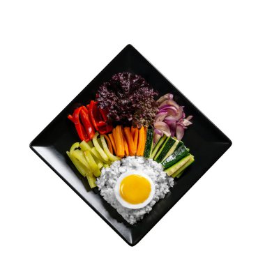 Korean meal isolate, with a variety of snacks with vegetables and eggs. Diet. bibimbap. Top view. square plate.