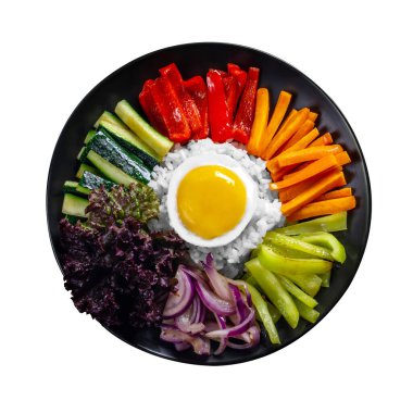 Close-up of Korean dish, isolate, variety of appetizers with vegetables and eggs. Diet. bibimbap. Top view. Round plate.