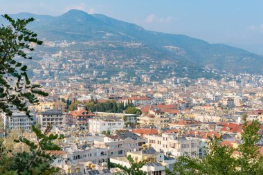 Alanya, Antalya, Turkey - August 2022: Exterior view of the houses at the foot of the mountain in the city of Alanya.