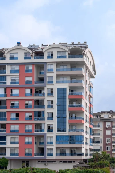 Modern luxury residential apartment. Residential building with blue sky. Facade of a modern apartment building.