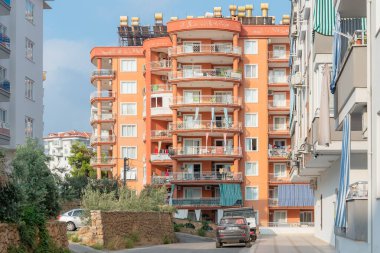 A typical Turkish street with apartment buildings on a summer day in Alanya, Turkey.