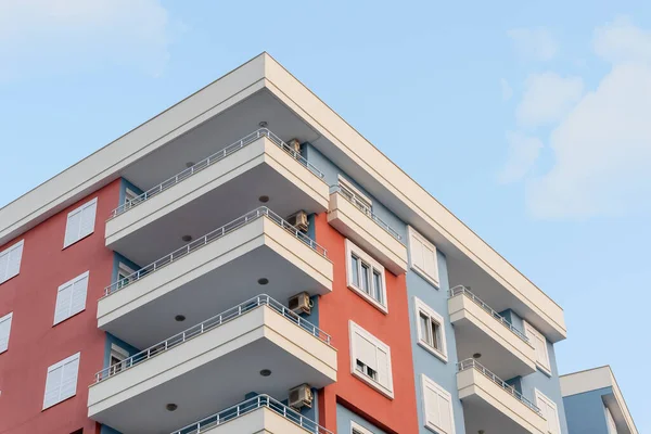 Modern ventilated facade with balconies. Fragment of a new elite residential building or commercial complex. Part of city real estate.