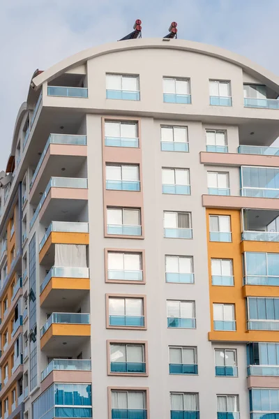 Modern luxury residential apartment. Residential building with blue sky. Facade of a modern apartment building.