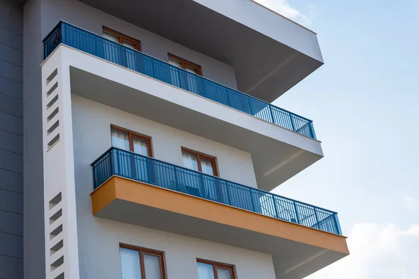 Modern luxury residential apartment. Residential building with blue sky. Facade of a modern apartment building.