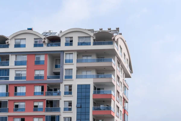 Modern luxury residential apartment. Residential building with blue sky. Facade of a modern apartment building.