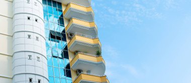 Residential building front view. Facade of an apartment building. Abstract architecture. Copy space.
