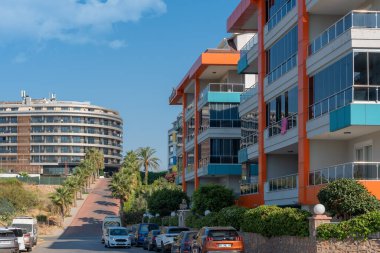 Alanya, Turkey - August, 2022: Cityscape of a residential area with modern apartment buildings on a sunny day.