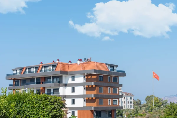 The exterior of an apartment building against the sky. Residential real estate in Turkey.