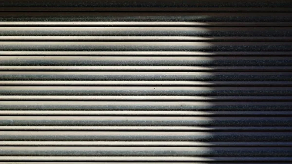 Sombra Sobre Puerta Metal Ondulado Como Fondo —  Fotos de Stock